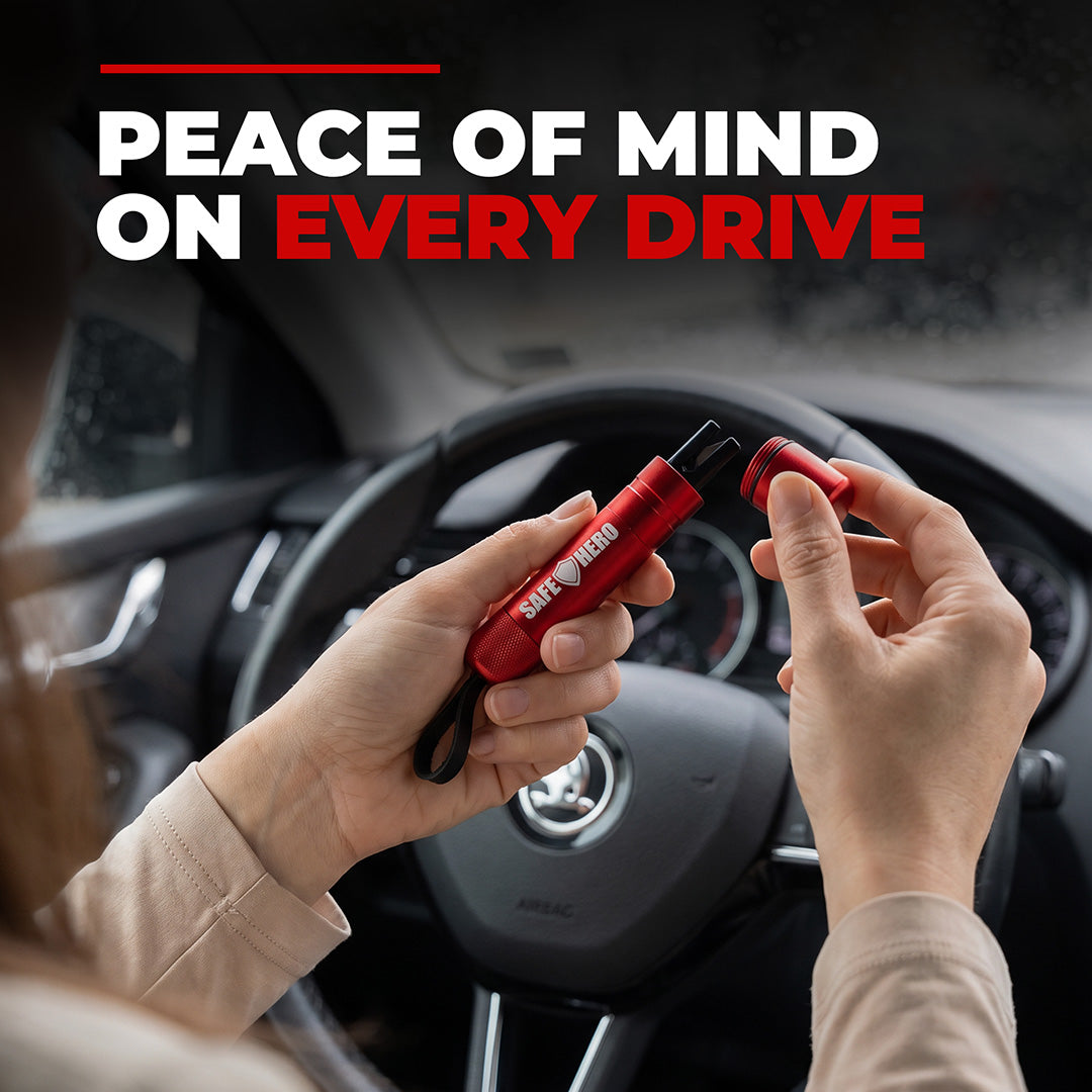 Driver opening the red Safe Hero Flash Hammer behind the steering wheel